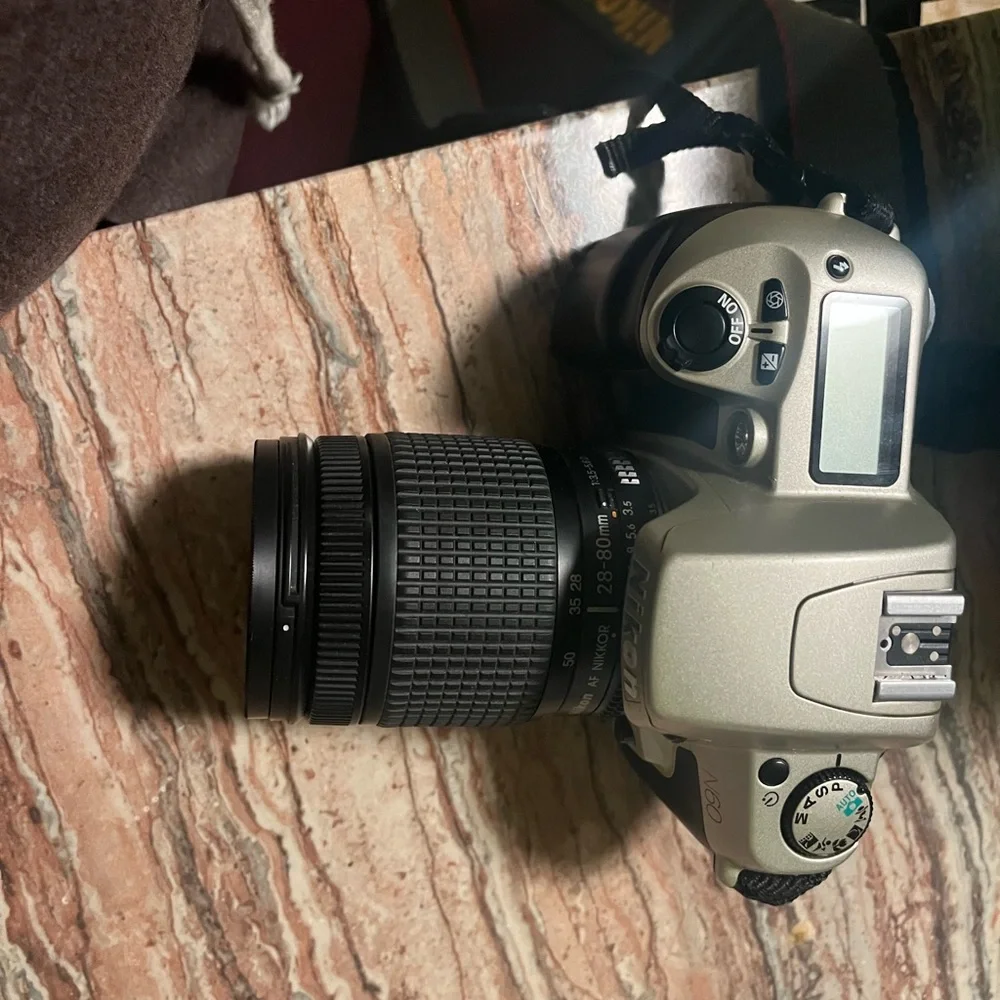 Black and grey Nikon film camera